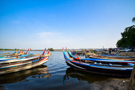 U Bein Bridge, Myanmar - May 29, 2015 : The villagers walking around U-Bein bridge, May 29, 2015, Mandalay, Myanmar. The bridge is the world longest teak bridge (1.2 km) and built across the Taungthaman Lake.のeditorial素材