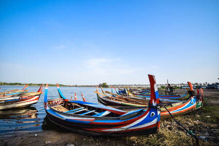 U Bein Bridge, Myanmar - May 29, 2015 : The villagers walking around U-Bein bridge, May 29, 2015, Mandalay, Myanmar. The bridge is the world longest teak bridge (1.2 km) and built across the Taungthaman Lake.のeditorial素材