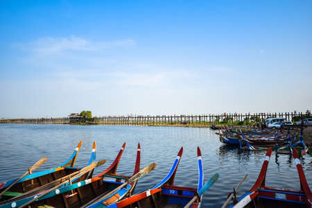U Bein Bridge, Myanmar - May 29, 2015 : The villagers walking around U-Bein bridge, May 29, 2015, Mandalay, Myanmar. The bridge is the world longest teak bridge (1.2 km) and built across the Taungthaman Lake.のeditorial素材