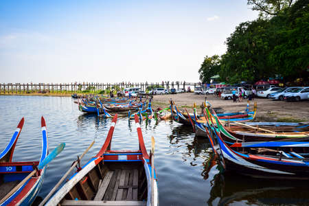 U Bein Bridge, Myanmar - May 29, 2015 : The villagers walking around U-Bein bridge, May 29, 2015, Mandalay, Myanmar. The bridge is the world longest teak bridge (1.2 km) and built across the Taungthaman Lake.のeditorial素材