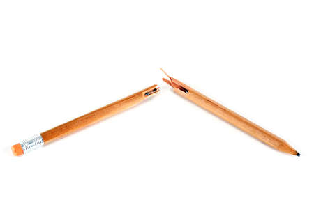 A broken pencil in front of a white background.の写真素材