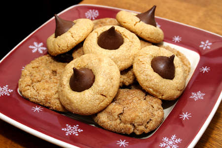 Assortment of cookies on a holiday-themed plate.