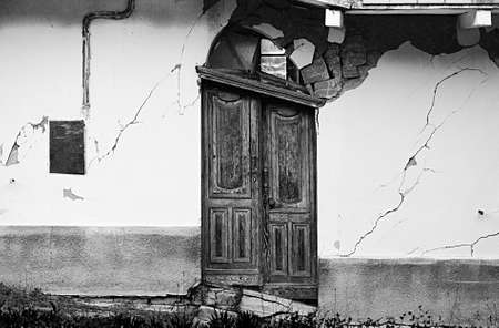 Door of a ruined house after a landslide in Piedmont, Italy の写真素材