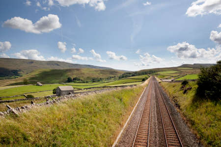Railway tracks near Kirkby Stephen, Cumbria looking toward Mallerstang and Wild Boar Fell の写真素材