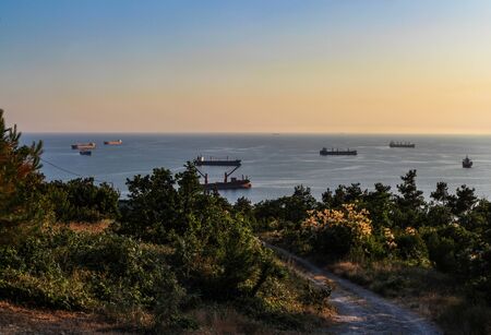 hike to the wild beach, view of the ships at sunset