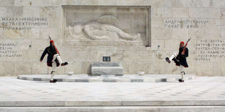 Athens, Greece - April 21, 2009: Evzones (ceremonial guards) in front of the Unknown Soldier's Tomb at the Greek Parliament Building in Athens, opposite Syntagma Square. Evzones guard the Tomb of the Unknown Soldier, the Hellenic Parliament and the Presidのeditorial素材