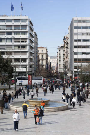 Athens, Greece - February 25, 2010: Athenians walking in Syntagma Square (Constitution Square) opposite Hellenic Parliament.のeditorial素材