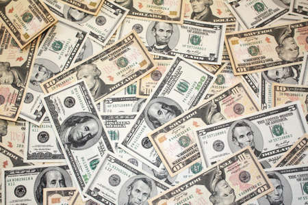Background of five, ten and one hundred dollar banknotes