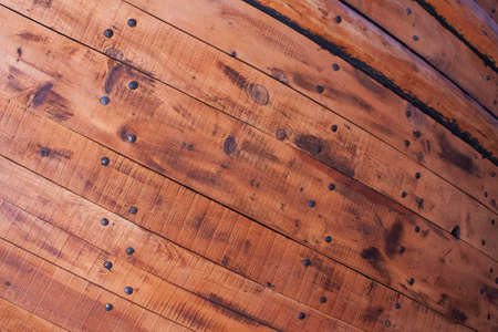 Wooden planks and nails from hull of an old ship の写真素材