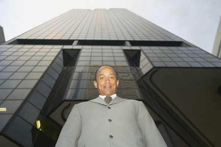 Low angle view of mid adult businessman looking at camera
