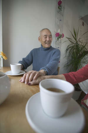 Senior man holding hands of a senior woman