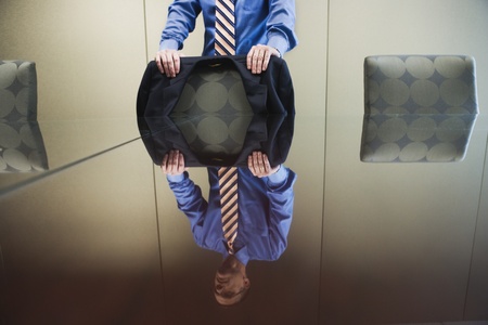 Businessman standing behind conference tableの写真素材