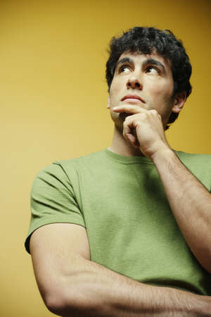 Young man contemplating