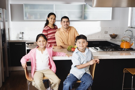 Portrait of family in domestic kitchen