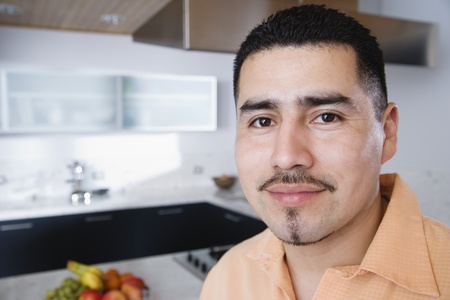 Headshot of man in kitchen
