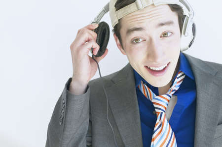 Man wearing headphones and listening to musicの写真素材