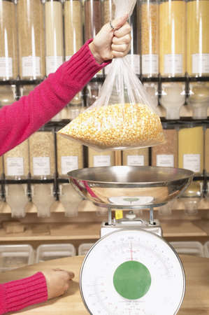 Person's hands lifting a plastic bag の写真素材