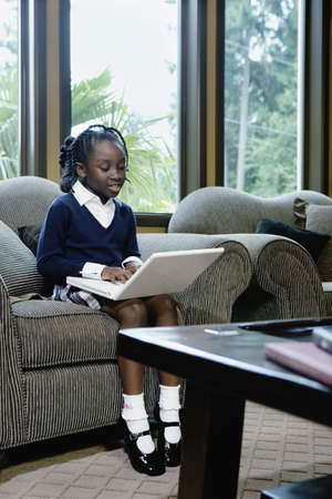 Girl working on her laptop computerの写真素材