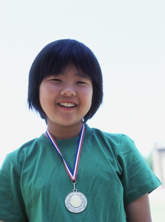 Portrait of girl with metal around neckの写真素材