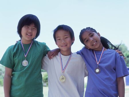 Group portrait of children wearing metalsの写真素材