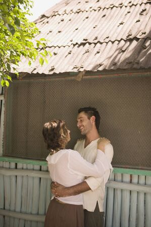 Young couple hugging outdoorsの写真素材
