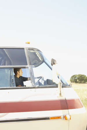 Young man driving a recreational vehicleの写真素材
