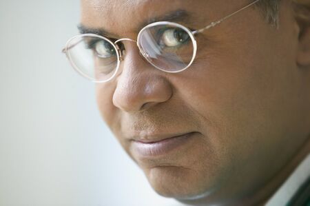 Close up of African American man with glassesの写真素材