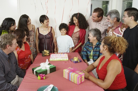 Family at young boyÃs birthday partyの写真素材