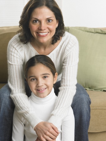 Mother and daughter smiling for the cameraの写真素材