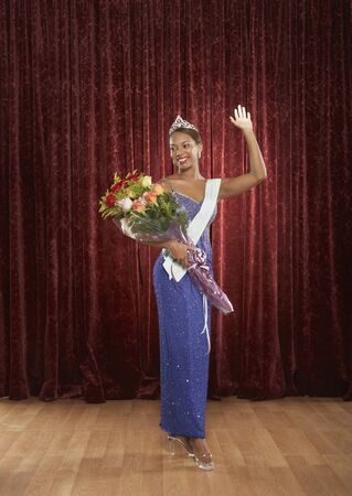 Beauty queen waving to the audienceの写真素材