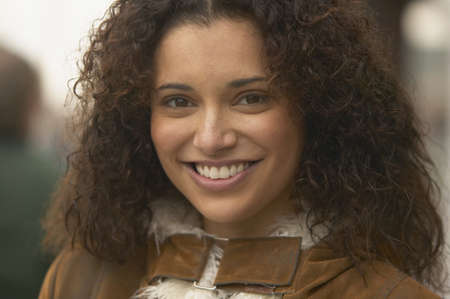 Young woman smiling for the cameraの写真素材