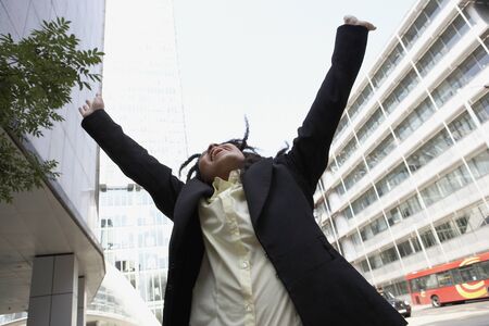 Male student with outstretched armsの写真素材