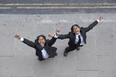 Students with outstretched armsの写真素材