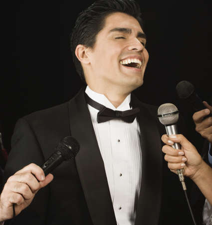 Male celebrity laughing for the pressの写真素材