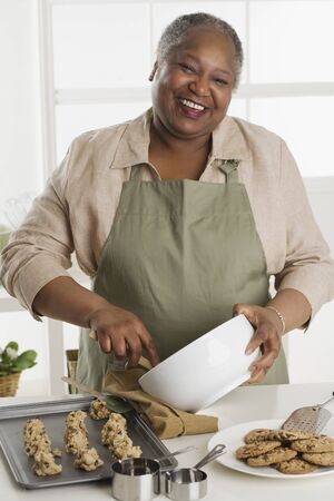 Senior woman making cookiesの写真素材