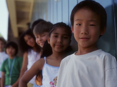 Group portrait of children standing in lineの写真素材