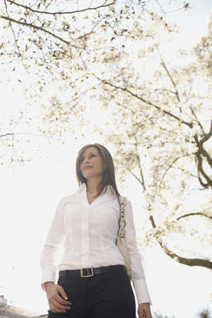 Hispanic woman walking outdoorsの写真素材