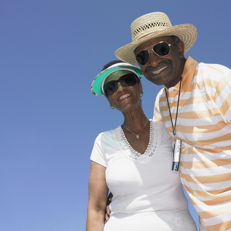 Low angle view of senior African couple smiling outdoors