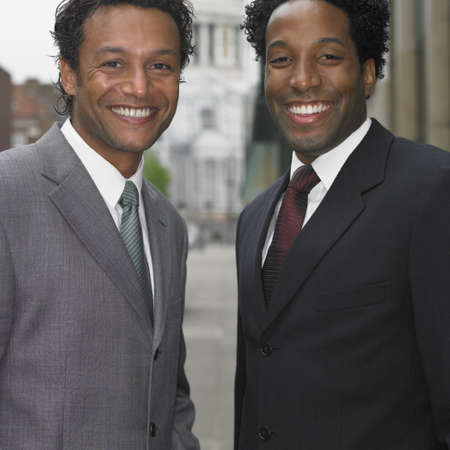 Two businessmen smiling outdoorsの写真素材