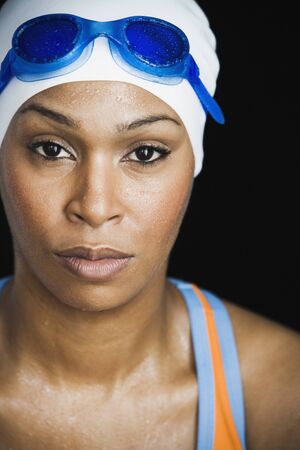 African woman wearing swimming cap and gogglesの写真素材