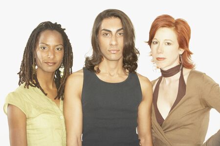 Studio shot of man with a woman on either side の写真素材