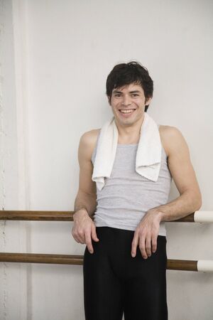 Portrait of Hispanic male doctor leaning against ballet barの写真素材