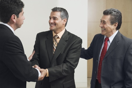 Hispanic businessmen shaking handsの写真素材