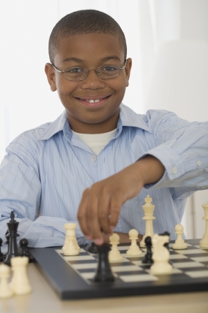 African boy playing chessの写真素材