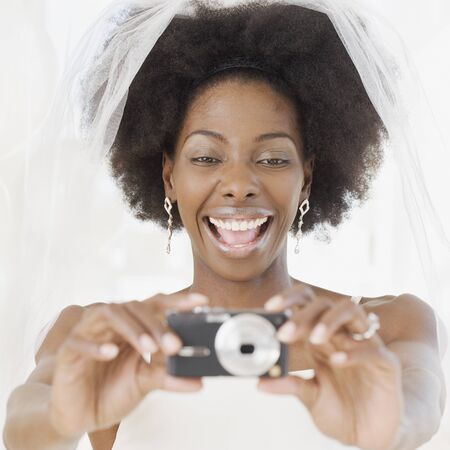 African bride taking photographの写真素材