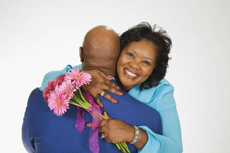 Portrait of senior African couple huggingの写真素材