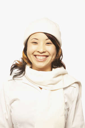 Portrait of Asian woman wearing hat and scarf