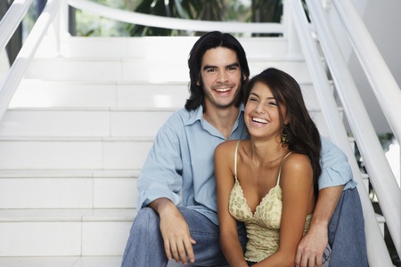 South American couple on stairsの写真素材
