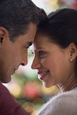 Hispanic couple smiling at each otherの写真素材