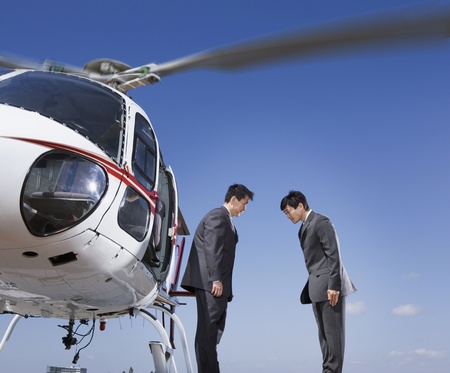Asian businessmen bowing to each otherの写真素材